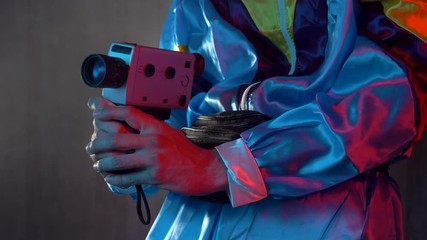 Videographer filming with a vintage 70s 80s video camera.