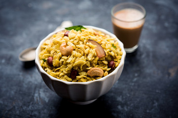 Jada Poha Namkeen Chivda / Thick Pohe Chiwda is a jar snack with a mix of sweet, salty and nuts flavours, served with tea. selective focus