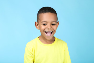 Cute american boy on blue background