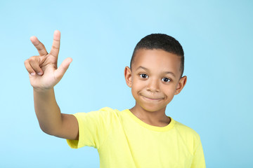 Cute american boy on blue background