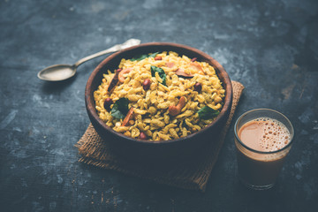 Jada Poha Namkeen Chivda / Thick Pohe Chiwda is a jar snack with a mix of sweet, salty and nuts flavours, served with tea. selective focus