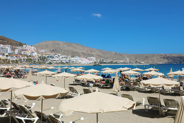 Fototapeta na wymiar TENERIFE, SPAIN - MAY 28, 2019: Playa del las Vistas beach on Adeje Coast, Tenerife.