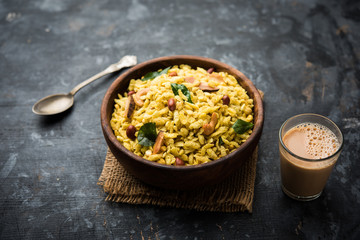 Jada Poha Namkeen Chivda / Thick Pohe Chiwda is a jar snack with a mix of sweet, salty and nuts flavours, served with tea. selective focus