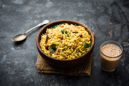 Jada Poha Namkeen Chivda / Thick Pohe Chiwda is a jar snack with a mix of sweet, salty and nuts flavours, served with tea. selective focus