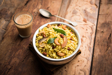 Jada Poha Namkeen Chivda / Thick Pohe Chiwda is a jar snack with a mix of sweet, salty and nuts flavours, served with tea. selective focus