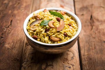 Jada Poha Namkeen Chivda / Thick Pohe Chiwda is a jar snack with a mix of sweet, salty and nuts flavours, served with tea. selective focus