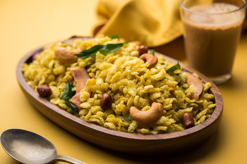 Jada Poha Namkeen Chivda / Thick Pohe Chiwda is a jar snack with a mix of sweet, salty and nuts flavours, served with tea. selective focus