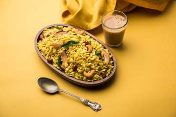 Jada Poha Namkeen Chivda / Thick Pohe Chiwda is a jar snack with a mix of sweet, salty and nuts flavours, served with tea. selective focus