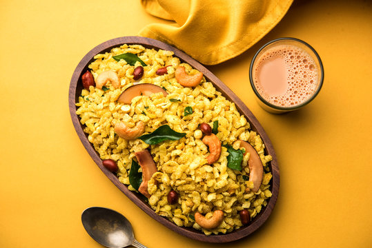 Jada Poha Namkeen Chivda / Thick Pohe Chiwda is a jar snack with a mix of sweet, salty and nuts flavours, served with tea. selective focus