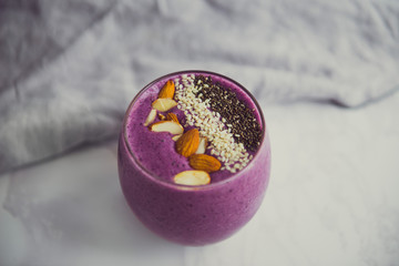 vegan smoothie with blueberry, almond, seasame and chia seeds - fresh natural breakfast
