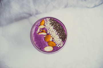 fresh blueberry smoothie with chia and almond top view