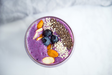 fresh blueberry smoothie with chia and almond top view