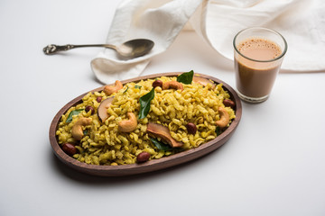 Jada Poha Namkeen Chivda / Thick Pohe Chiwda is a jar snack with a mix of sweet, salty and nuts flavours, served with tea. selective focus