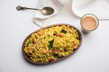 Jada Poha Namkeen Chivda / Thick Pohe Chiwda is a jar snack with a mix of sweet, salty and nuts flavours, served with tea. selective focus