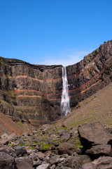 Long exposure photo of waterfall, view of the Hengifoss waterfall in Iceland, Europe.