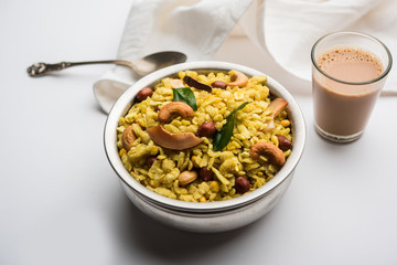 Jada Poha Namkeen Chivda / Thick Pohe Chiwda is a jar snack with a mix of sweet, salty and nuts flavours, served with tea. selective focus
