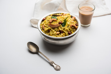 Jada Poha Namkeen Chivda / Thick Pohe Chiwda is a jar snack with a mix of sweet, salty and nuts flavours, served with tea. selective focus