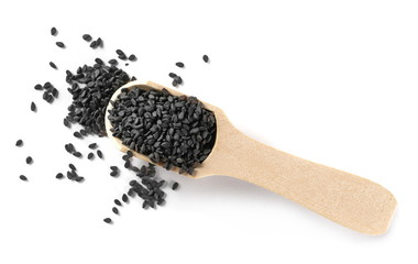 Black organic sesame seeds with wooden spoon isolated on white background, top view