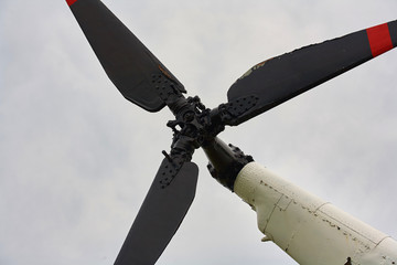 Propeller from a helicopter close-up on a background of gray sky.