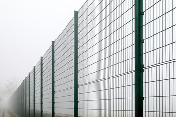 Fototapeta na wymiar tall and long fence