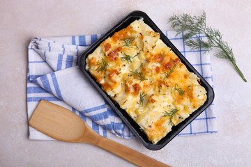 Baked cauliflower in plastic container