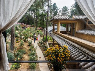 Garden with green house at a Buddhist womens cloister in the City of Dali (China).