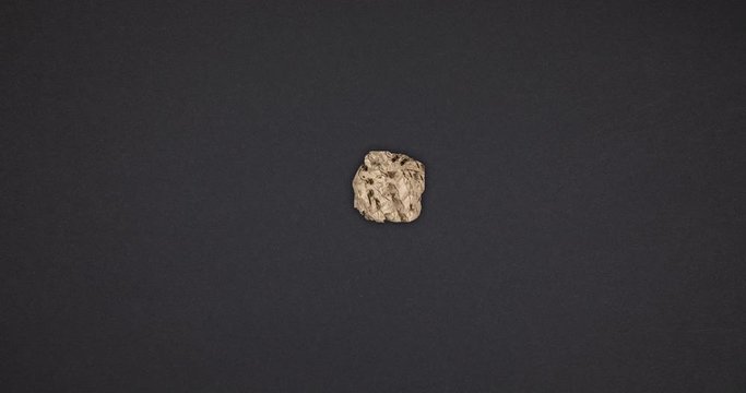 Timelapse of crumpled paper ball