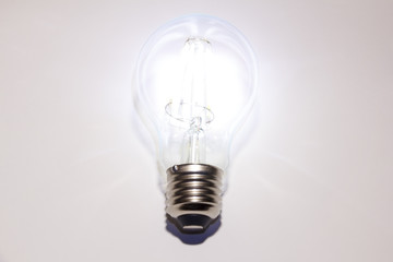 Filament lamps. Retro decorative glowing led light bulb on a white background