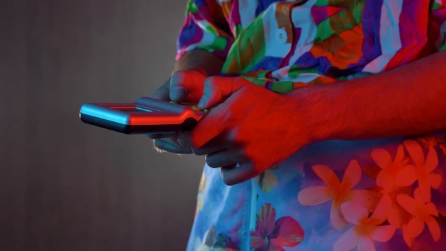 Playing a vintage portable video game in the 80s 90s