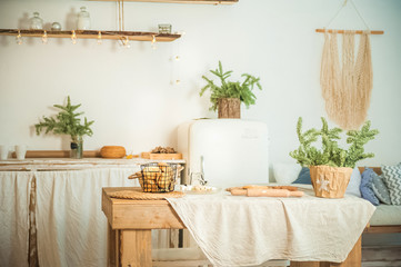Details of still life in the home interior kitchen. Cozy autumn-winter concept. Beautiful apartment kitchen decorated for Christmas and New Year close-up and copy space. Stylish apartments in the styl