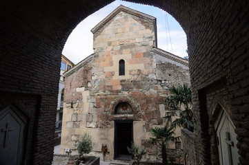Naklejka premium View through the arch on Anchiskhati Church of the Nativity of the virgin Mary 6th century, Tbilisi.