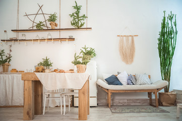 Details of still life in the home interior kitchen. Cozy autumn-winter concept. Beautiful apartment kitchen decorated for Christmas and New Year close-up and copy space. Stylish apartments in the styl