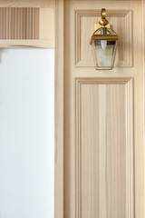Details of wardrobe case with shutter plank doors and lantern, modern house interior