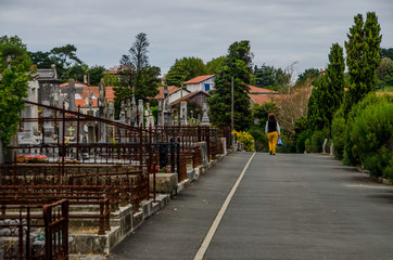 Woman leaving the cemetery of Biarritz in September 3013. France