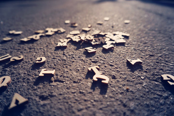 Letters fall on the asphalt, tinted photo of the English alphabet, learning and science.