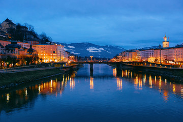 Fototapeta premium Panorama of Salzburg Old city and Salzach River Austria night