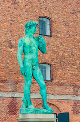 Naklejka premium Replica of Michelangelo's statue of David outside The Royal Cast Collection building on Langelinie Promenade. Copenhagen. Denmark