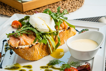 sandwich with salted salmon and poached egg