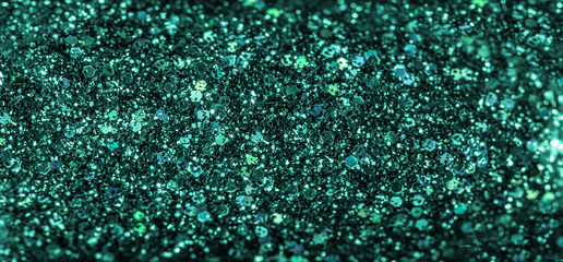Mint colored holiday glitter background. Blurred festive green backdrop for your design. Holiday concept