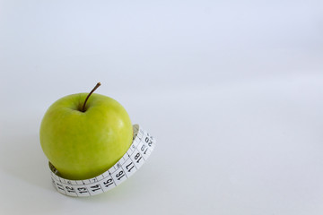 green apple food diet with centimeter isolated on white background