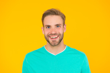 Kind smile. Self care. Handsome man yellow background. Well groomed guy with bristle and nice hairstyle. Male beauty. Barber hairdresser salon. Bearded man. Skin care. Facial care. Keep youth