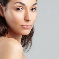 Fototapeta premium Young beautiful woman with clean perfect skin close-up.