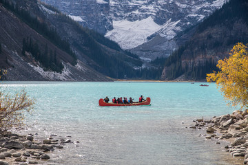 canoeing on turquoise louise lake in Banff National park, Canada fall
