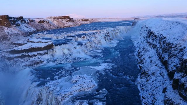Aerial view of frozen Gullfoss waterfall in Iceland with wild river