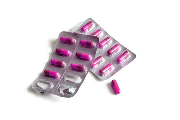 Blister packs with pink capsules