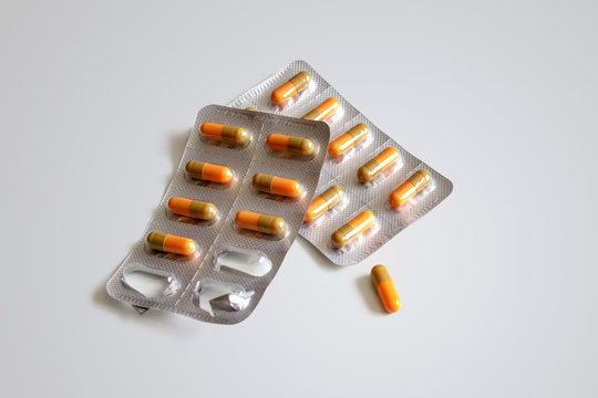 Two blister packs with capsules