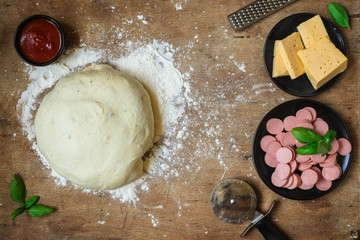 pizza ingredient and  dough (tomato sauce, sausages, cheese and more) menu concept. food background. copy space