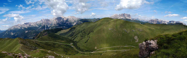 Fototapeta na wymiar panoramic view of Latemar mountain Sassolungo Sassopiatto and the Sella group, Val di fassa, Trentino, Italy landscape