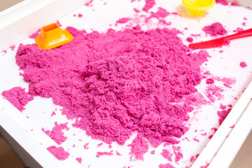 Kinetic Sand In A Heap For Indoor Game Or Children Creativity. Forms for the construction of the...