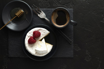 coffe, camembert, raspberries, honey on a dark backgraund minimalistic, breakfast